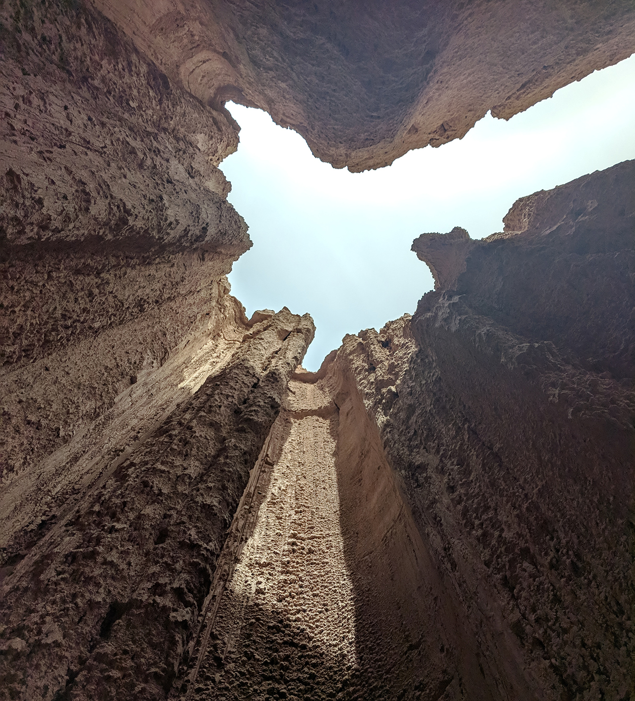 Looking upwards at the sky from the slot canyon